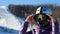 Woman face in a helmet and a mask from cold, frost and wind puts on sunglasses preparing for skiing.Mountaineering ski