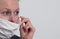 Woman with face mask protecting herself from coronavirus  stock photo