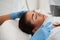 Woman face receiving ultrasound procedure