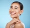 Woman, face and smile, happy and beauty with natural cosmetics and glow isolated against blue background. Clean