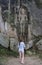 Woman facing ancient high holy statue