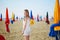 Woman with famous colorful parasols on Deauville Beach in France