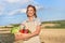 Woman farmer apron standing farmland smiling Female agronomist specialist farming agribusiness Happy positive caucasian worker