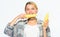 Woman farmer bite yellow corn cob on white background. Girl rustic style hold ripe corn. Vegetarian product. Raw food