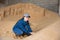 Woman farmer checking quality of soybean husk