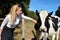 Woman farmer with dairy cow