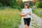 Woman farmer holding basket of fresh eggs, nature, garden, countryside background