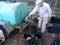 Woman Farmer Pouring Molasses