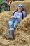 Woman Farmer Resting in Hay