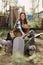 Woman farmer smiles feeds birds chickens organic food for bird health and good eggs and care for the environment, sunset