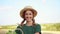 Woman farmer straw hat apron standing farmland smiling Female agronomist specialist farming agribusiness Happy positive