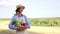 Woman farmer straw hat apron standing farmland smiling Female agronomist specialist farming agribusiness Happy positive