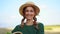 Woman farmer straw hat apron standing farmland smiling Female agronomist specialist farming agribusiness Happy positive