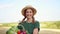 Woman farmer straw hat apron standing farmland smiling Female agronomist specialist farming agribusiness Happy positive