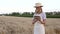 Woman farmer straw hat smart farming standing farmland smiling using digital tablet Female agronomist specialist