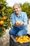 Woman farmer tasting mandarins