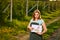 Woman farmer working in fruit garden and shows the level of crop growth using infographics. Biologist inspector examines