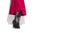 Woman fashion boots, elegant footwear. Young woman legs in suede black shoes. Red midi pleated skirt