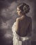 Woman fashion dress, retro hair style, naked back, historical romance portrait