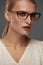 Woman In Fashion Glasses. Beautiful Female In Stylish Eyeglasses