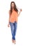 Woman, fashion and studio portrait with hair, hand and smile for orange fabric shirt, flirt or confident by white