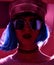 Woman in fashion winter concept wearing gold hat cap round sunglasses in pink neon light