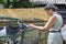 Woman feeding goats out of his hand in an aviary of a zoo