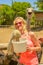 Woman feeding Ostriches