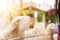 Woman and feeding sheep chewing grass in farm