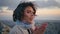 Woman feeling cold rocky terrain at evening serenity closeup. Portrait traveler