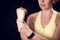 Woman feeling strong arm pain. Fitness and healthcare concept