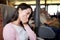 Woman feeling unwell and sitting on the ferry