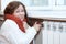 Woman feels cold when turning thermostat of central heating con