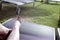 Woman feet on pool lounger sunbathing