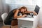 The woman fell asleep from fatigue at the work table.The view from the top. Concept of stress at work, quarantine and self-
