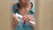 Woman filing nails with nail file. Young woman doing home manicure. Nail care and home manicure concept.