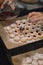 Woman filling jam into Christmas cookies