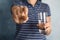 Woman with fish oil pill and glass of water