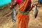 Woman fisherman with freshly harvested fish in hand