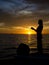 Woman fishing from boat along Gulf Coast