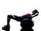 Woman fitness ball crunches exercises silhouette