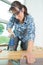 Woman fitting wooden floor at home