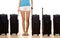 Woman with five suitcases