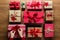 Woman fixing a bow on beautifuly wrapped vintage christmas presents on wooden background