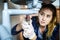 Woman fixing kitchen sink at home