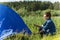 Woman fixing tent