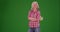 Woman in flannel shirt smiling at camera, proud of farming on greenscreen