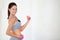 Woman, flex or portrait with dumbbells in studio, health wellness or fitness action for weight loss with exercise. Young