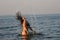 Woman Flipping Hair in Water