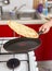 Woman flipping pancake in the pan